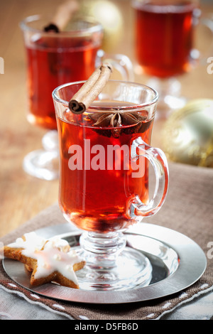 Mulled wine with cinnamon sticks and gingerbread cookies Stock Photo