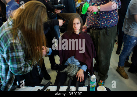 A model is prepared ahead of the Paul Smith collection during London Fashion Week. Stock Photo