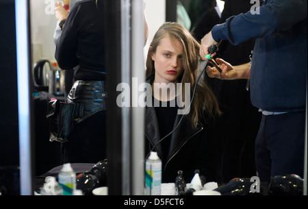 A model is prepared ahead of the Paul Smith collection during London Fashion Week. Stock Photo