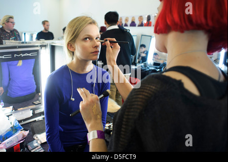 A model is prepared ahead of the Paul Smith collection during London Fashion Week. Stock Photo