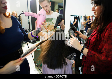 A model is prepared ahead of the Paul Smith collection during London Fashion Week. Stock Photo