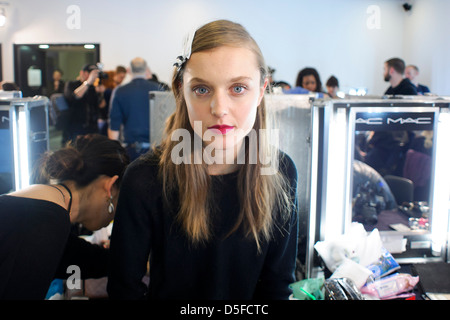 A model is prepared ahead of the Paul Smith collection during London Fashion Week. Stock Photo