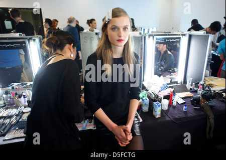 A model is prepared ahead of the Paul Smith collection during London Fashion Week. Stock Photo