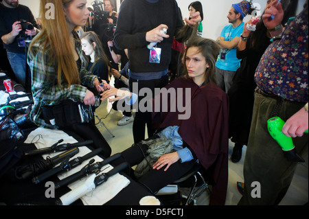 A model is prepared ahead of the Paul Smith collection during London Fashion Week. Stock Photo