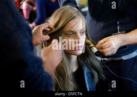 A model is prepared ahead of the Paul Smith collection during London Fashion Week. Stock Photo