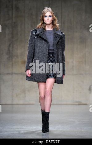 A model wears a design from the Unique collection during London Fashion Week. Stock Photo