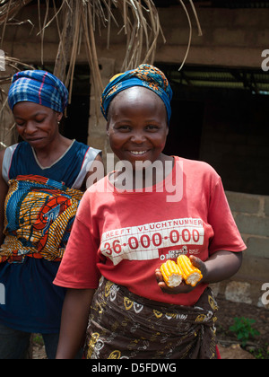 Young african woman holding corn near Bamenda Cameroon Stock Photo