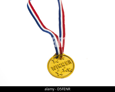 Gold medal winner pendant on a white background Stock Photo