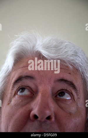 Man With Silver Hair Looking Up Stock Photo