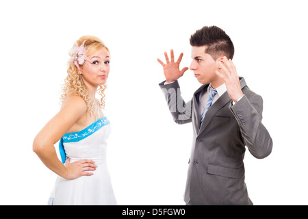 Unhappy bride and angry groom arguing, isolated on white background Stock Photo