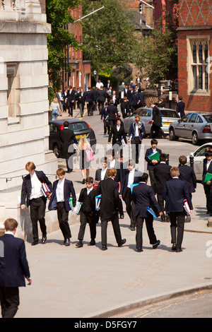England, Berkshire, Eton College students in tail-coat uniform between classes Stock Photo