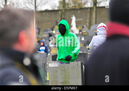 Londonderry, UK. 1st April, 2013. Masked youth the 32 County Sovereignty Movement (CSM) march to commemorate the 97th anniversary of the 1916 Easter Rising. Credit: George Sweeney/Alamy Live News Stock Photo