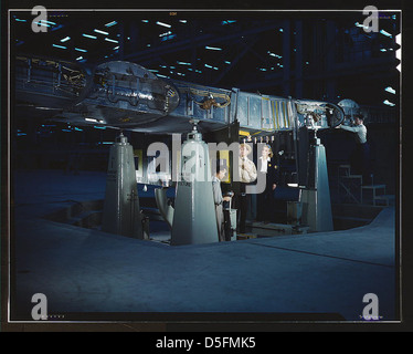 Working on wing of Consolidated Liberator Bomber, Consolidated Aircraft Corp. plant, Fort Worth, Texas (LOC) Stock Photo