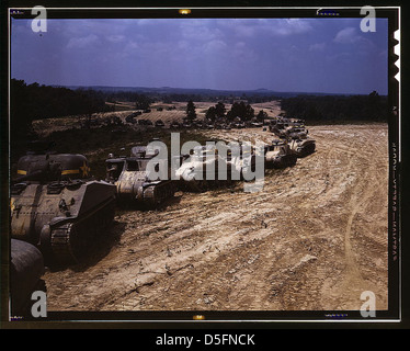 Parade of M-4 (General Sherman) and M-3 (General Grant) tanks in training maneuvers, Ft. Knox, Ky. Note the lower design of the M-4, the larger gun in the turret and the two hatches in front of the turret (LOC) Stock Photo