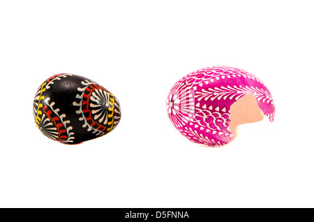 two broken ornamental easter eggs isolated on white Stock Photo