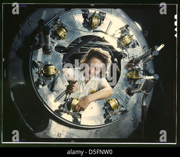 Part of the cowling for one of the motors for a B-25 bomber is assembled in the engine department of North American [Aviation, Inc.]'s Inglewood, Calif., plant (LOC) Stock Photo