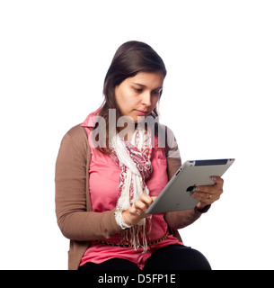 Young woman using iPad on white background Stock Photo