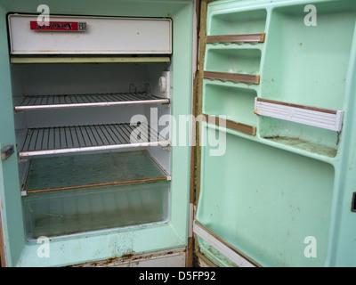 Old fridge empty with open door Stock Photo