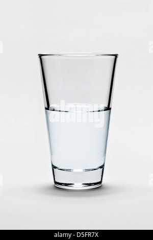 Glass half-full or half-empty Stock Photo