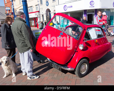 A beautifully restored BMW Isetta bubble car on display in Redcar High Street March 2013 Stock Photo