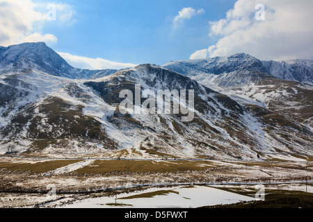 View across Nant Ffrancon valley to Bwlch y Brecan between Foel Goch mountain and Mynydd Perfedd with snow in Snowdonia Wales UK Stock Photo
