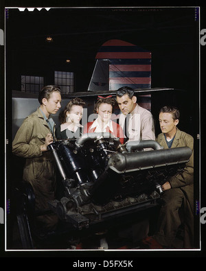 A photograph from 1942 showing students at Washington High School in Los Angeles, California, participating in training to contribute to the war effort during World War II. The image captures both boys and girls in an educational setting focused on military and industrial contributions. Stock Photo