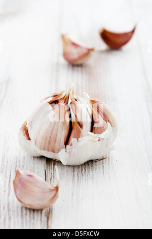 Fresh garlic onwhite wooden table, selective focus Stock Photo