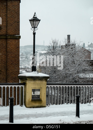 SHEFFIELD, UK - MARCH 23, 2013:  Lamp and Plaque on Lady's Bridge in Winter Stock Photo