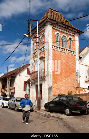 Madagascar, Antananarivo, Amparibe, man walking down steep road Stock Photo