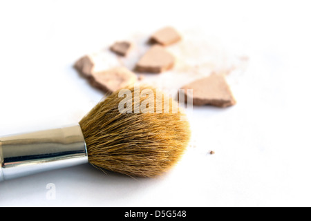 A Makeup Brush with crushed foundation isolated on white background Stock Photo