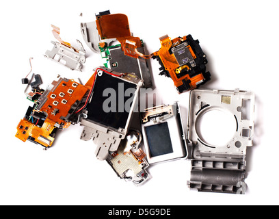 Broken compact digital camera parts prepared. Stock Photo