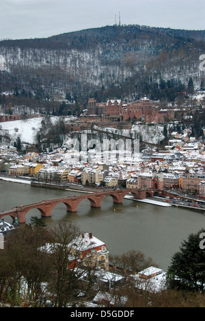 Heidelberg Old Town in winter, with view of the Königstuhl mountain above the castle and Old Bridge over the River Neckar Stock Photo