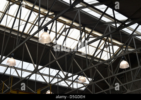 Old industrial warehouse roof, A frames gantries, glass ceiling and large lights Stock Photo