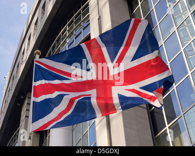 British flag in front of the European Parliament building in Brussels, Belgium Stock Photo