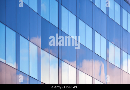 Nice clouds reflections in windows of modern office building Stock Photo