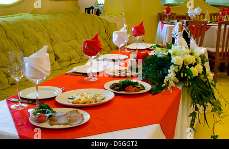 Table laid for dinner in modern restorant Stock Photo