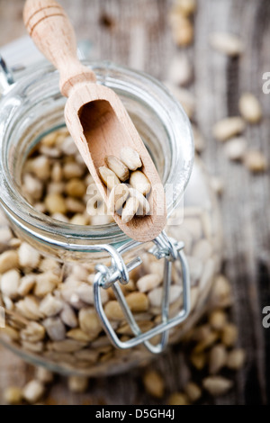 Close up of sunflower seeds in glass jar Stock Photo