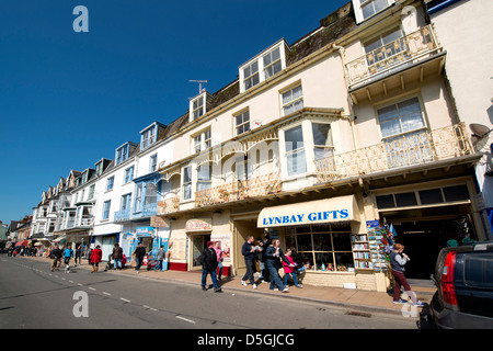 tourism gift shops align the seafront in the coastal harbour town of Ilfracombe, Devon, UK Stock Photo