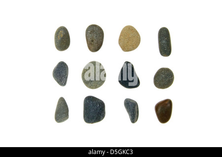 Twelve smooth, rounded beach stones of Maine granite, jasper, and schist. Stock Photo