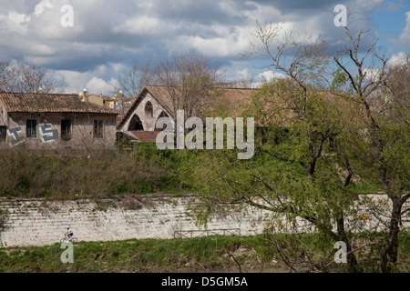 Ancient building on the Tiber river in Rome and a cyclist Stock Photo