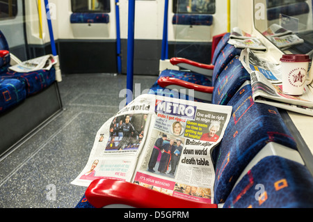 Free newspapers left on a London Underground carriage. Stock Photo