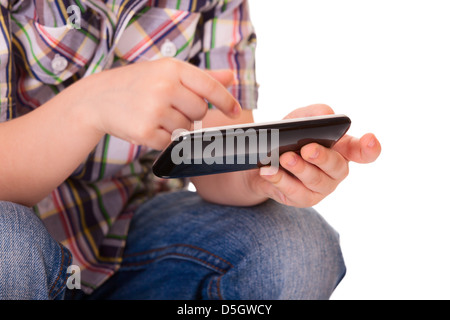 Close up of a kid hands using mobile smart phone. Selective focus on the left hand. Stock Photo