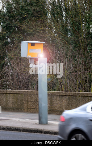 Yellow gatso roadside flashing speed camera on Twickenham Bridge Surrey Stock Photo