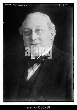 F.C. Hoffman is shown wearing bow ties and pince-nez in this portrait. Hoffman’s fashion choice reflects the formal attire of the period. His distinctive style, including the pince-nez, was part of early 20th-century fashion trends. Stock Photo