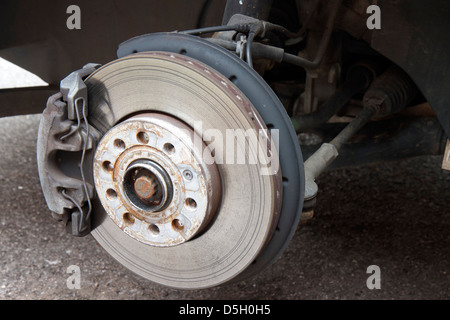 Front Ventilated Disc Brake and Caliper on a Volkswagen Golf Mark 6 GT.  The disc is worn. Stock Photo