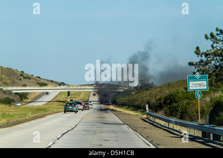 A car fire on highway 101 in California Stock Photo