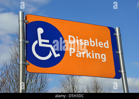 Disabled parking sign outside Tesco Extra Supermarket, Addlestone, Surrey, England, United Kingdom Stock Photo