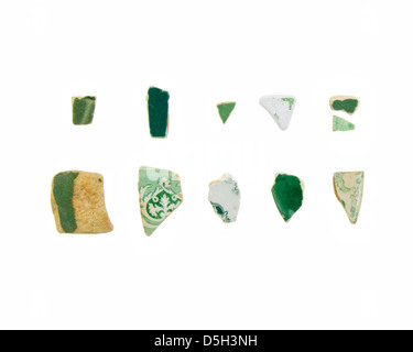 Eleven pieces of green and white sea china on a white background. Stock Photo