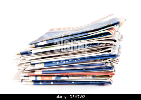 Stack of newspapers on white background Stock Photo