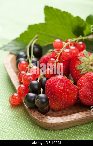 fresh berries in wooden bowl Stock Photo